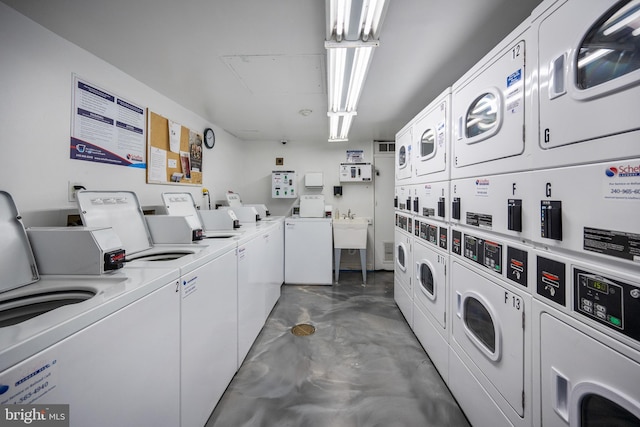 1615 Q St NW Unit 1001, Washington, DC 20009 - community laundry room with independent washer and dryer and stacked washer and clothes dryer