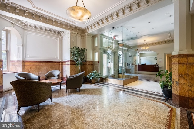 1615 Q St NW Unit 1001, Washington, DC 20009 - lobby with a wainscoted wall, ornamental molding, a decorative wall, and a towering ceiling