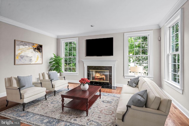 501 Van Lears Run, Villanova, PA 19085 - living area featuring healthy amount of natural light, ornamental molding, and wood finished floors