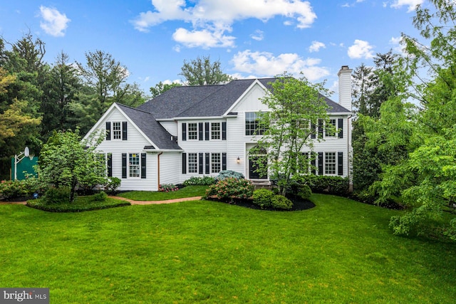 501 Van Lears Run, Villanova, PA 19085 - view of front of home featuring a front yard, a chimney, and roof with shingles