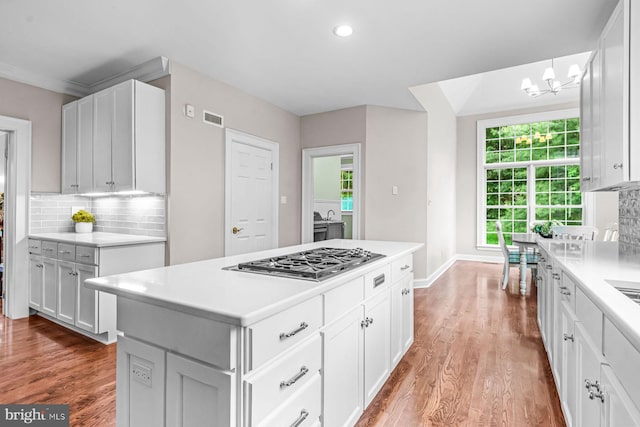 501 Van Lears Run, Villanova, PA 19085 - kitchen with stainless steel gas cooktop, tasteful backsplash, wood finished floors, and recessed lighting