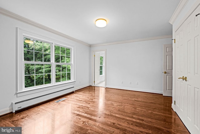 501 Van Lears Run, Villanova, PA 19085 - unfurnished bedroom featuring baseboard heating, ornamental molding, and wood finished floors