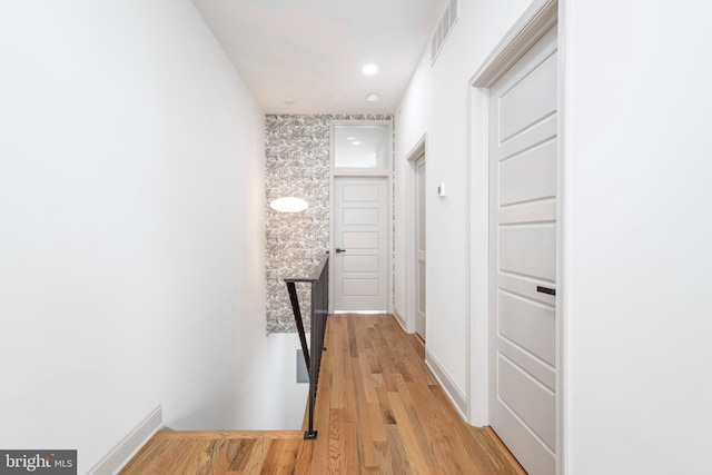 3116 Clifford St Unit 2, Philadelphia, PA 19121 - corridor with light wood finished floors, recessed lighting, and an upstairs landing