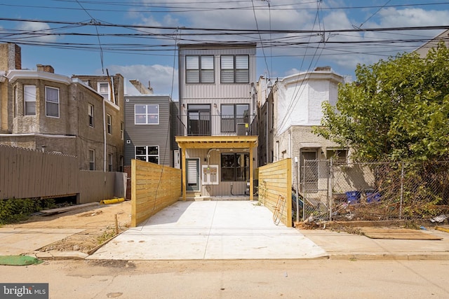 3116 Clifford St Unit 2, Philadelphia, PA 19121 - townhome / multi-family property with a fenced front yard, a gate, and board and batten siding