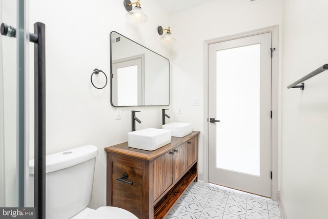 3116 Clifford St Unit 2, Philadelphia, PA 19121 - bathroom with double vanity and toilet