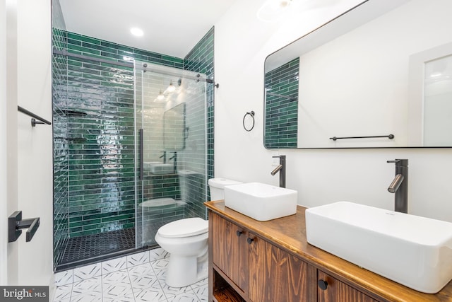 3116 Clifford St Unit 2, Philadelphia, PA 19121 - bathroom featuring a stall shower, double vanity, tile patterned floors, and recessed lighting