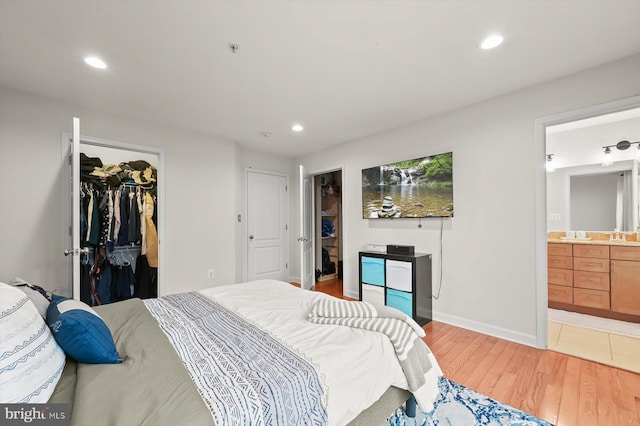 1506 Stack St, Baltimore, MD 21230 - bedroom featuring a spacious closet, light wood finished floors, recessed lighting, a closet, and connected bathroom