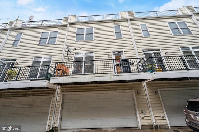 1506 Stack St, Baltimore, MD 21230 - rear view of house featuring a balcony and an attached garage