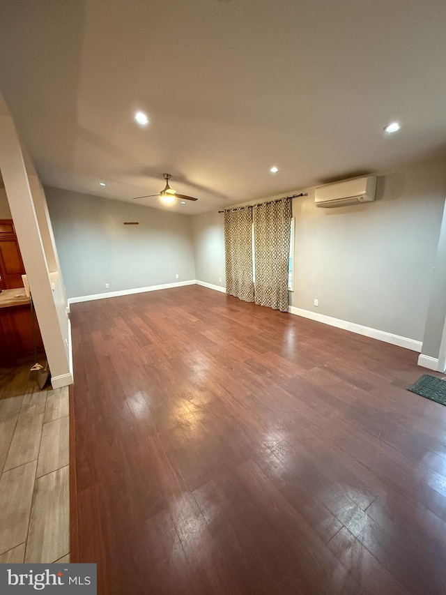 751 Hudson Dr, Weatherly, PA 18255 - spare room featuring a wall mounted AC, a ceiling fan, recessed lighting, and wood finished floors