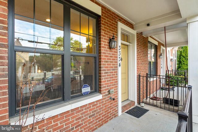 3334 7th St NE, Washington, DC 20017 - entrance to property featuring covered porch and brick siding