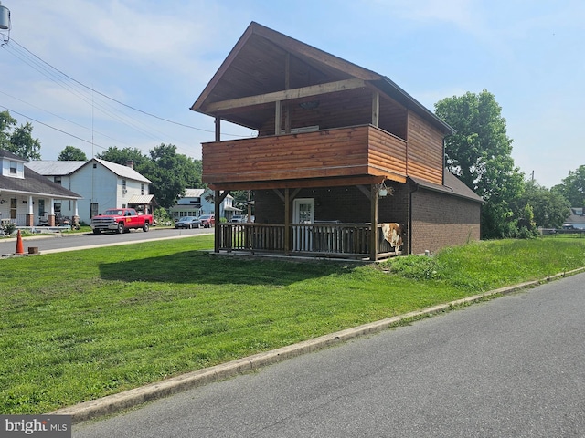 6 Amelia St, Paw Paw, WV 25434 - contemporary home with brick siding, a front lawn, a balcony, and covered porch