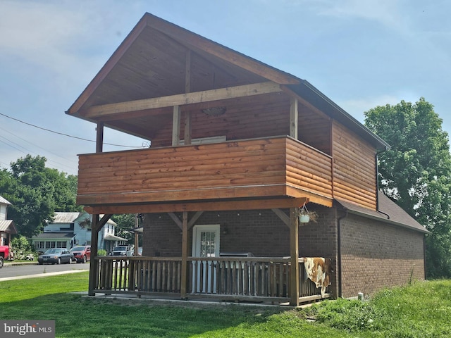 6 Amelia St, Paw Paw, WV 25434 - view of side of home with brick siding and a yard