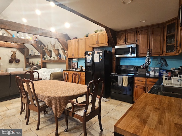 6 Amelia St, Paw Paw, WV 25434 - kitchen with black appliances, butcher block counters, open floor plan, glass insert cabinets, and lofted ceiling