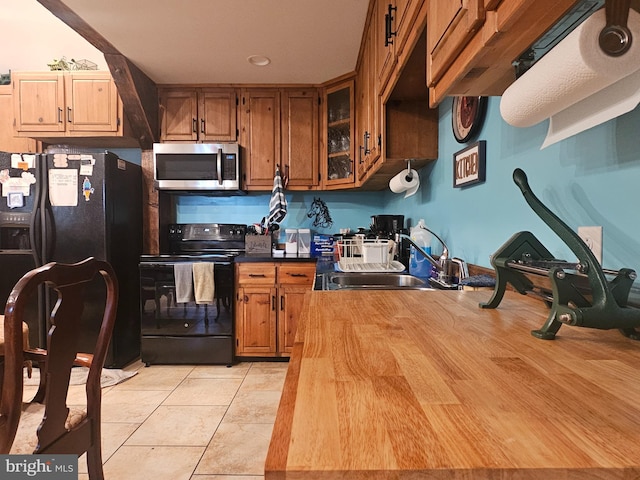 6 Amelia St, Paw Paw, WV 25434 - kitchen featuring stainless steel microwave, black electric range, fridge with ice dispenser, brown cabinets, and glass insert cabinets