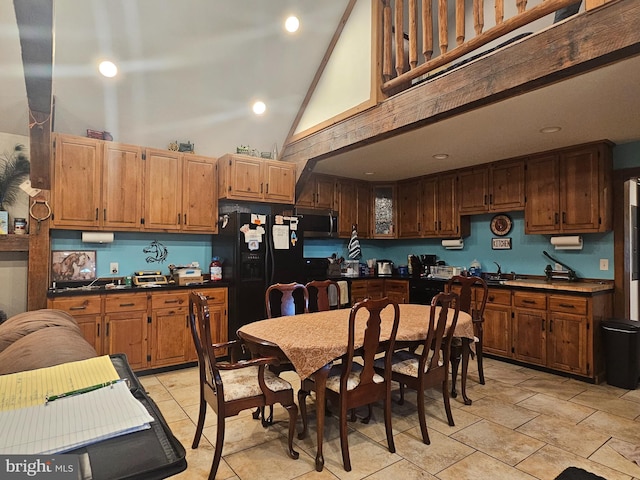 6 Amelia St, Paw Paw, WV 25434 - kitchen featuring high vaulted ceiling, stainless steel microwave, dark countertops, black fridge with ice dispenser, and recessed lighting