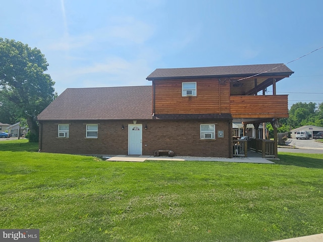 6 Amelia St, Paw Paw, WV 25434 - rear view of house with a patio, a yard, brick siding, and a shingled roof