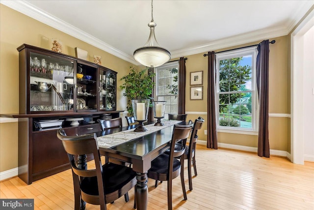926 Kenmara Dr, West Chester, PA 19380 - dining space with plenty of natural light, light wood-style flooring, and crown molding