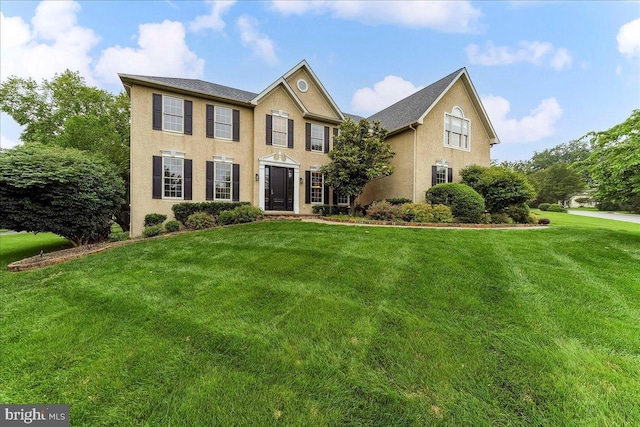 926 Kenmara Dr, West Chester, PA 19380 - colonial house featuring a front lawn and stucco siding