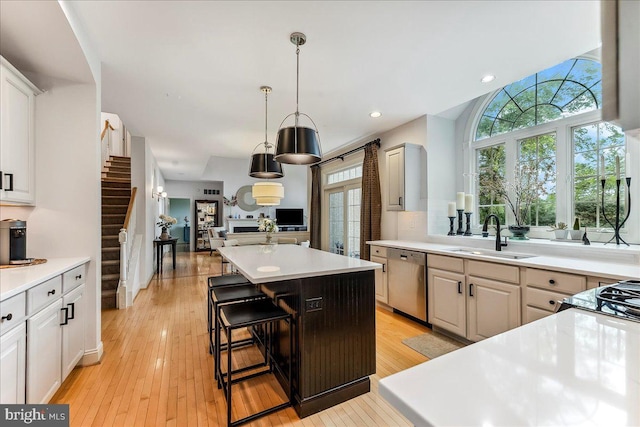 926 Kenmara Dr, West Chester, PA 19380 - kitchen with stainless steel dishwasher, a center island, healthy amount of natural light, light countertops, and recessed lighting