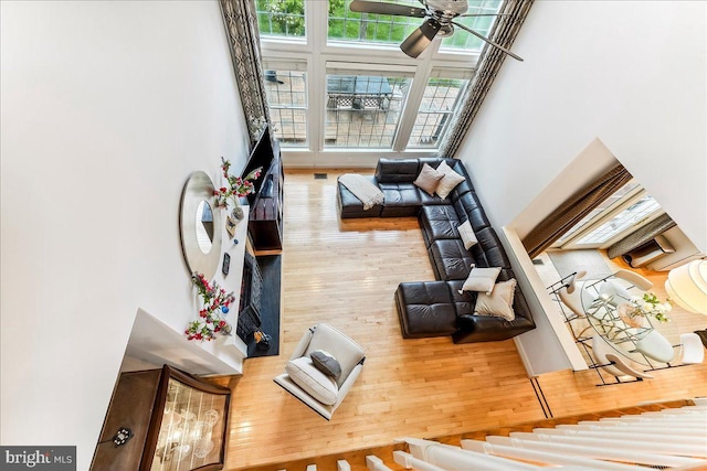 926 Kenmara Dr, West Chester, PA 19380 - living area with a ceiling fan, hardwood / wood-style floors, and a towering ceiling