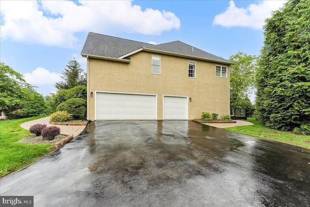 926 Kenmara Dr, West Chester, PA 19380 - view of property exterior featuring a garage, driveway, stucco siding, and roof with shingles