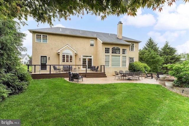 926 Kenmara Dr, West Chester, PA 19380 - back of property with a chimney, a lawn, a patio area, a deck, and stucco siding