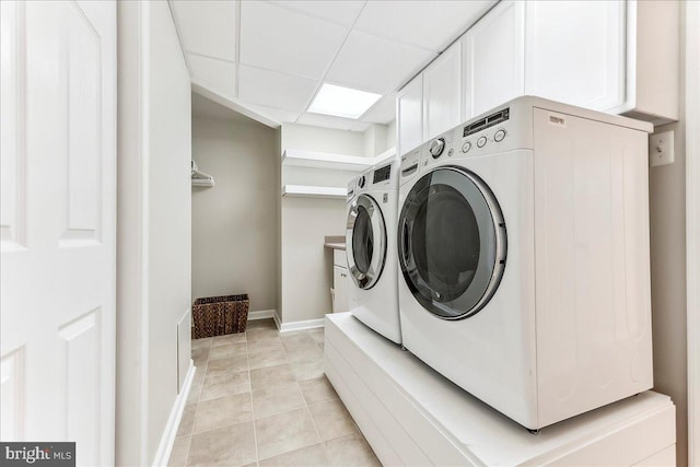 926 Kenmara Dr, West Chester, PA 19380 - washroom with washer and clothes dryer, light tile patterned floors, and cabinet space
