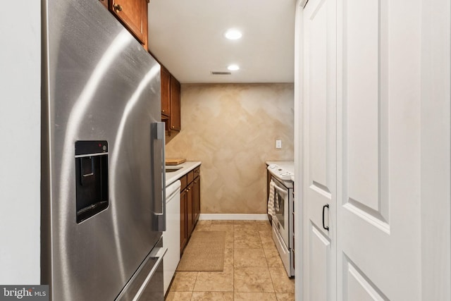 765 S 2nd St Unit G, Philadelphia, PA 19147 - kitchen with white appliances, light countertops, brown cabinetry, and recessed lighting