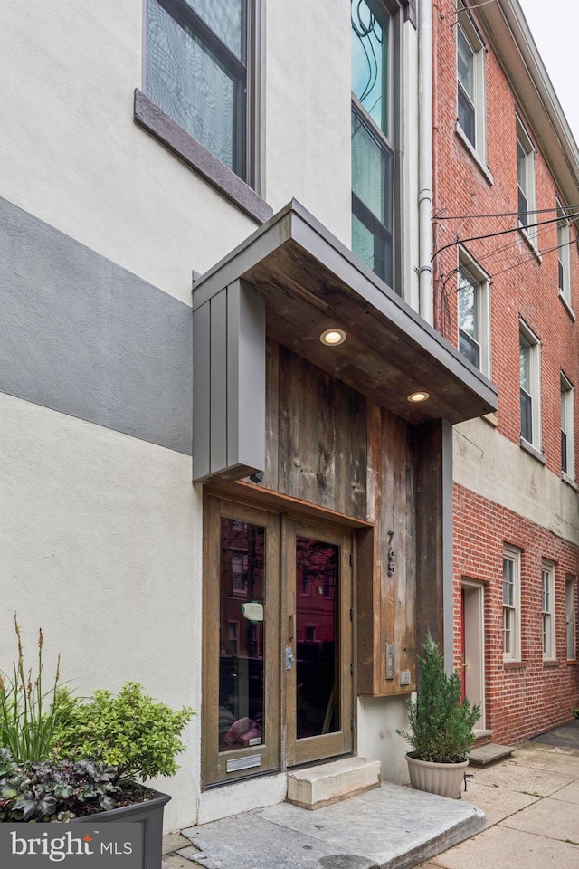 765 S 2nd St Unit G, Philadelphia, PA 19147 - doorway to property featuring stucco siding and brick siding