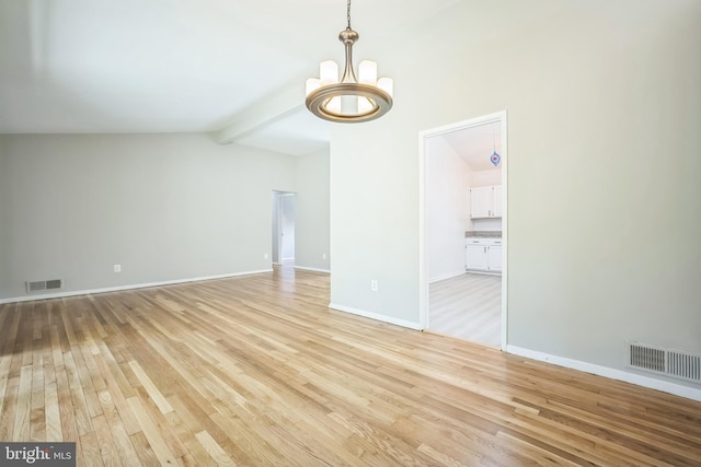 7826 Glenister Dr, Springfield, VA 22152 - unfurnished room with a chandelier and light wood-style floors