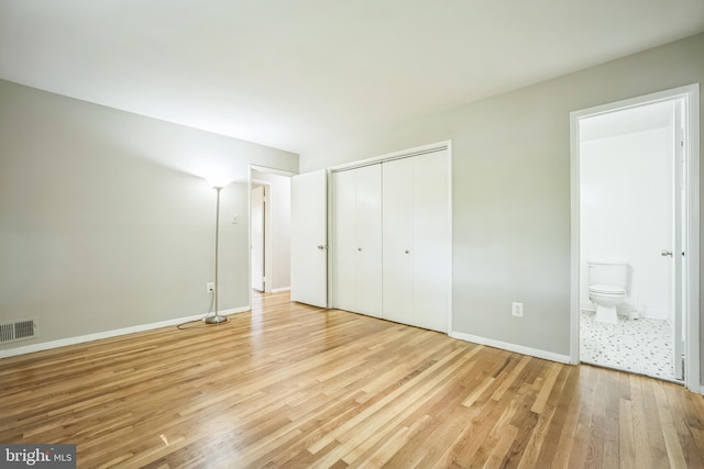 7826 Glenister Dr, Springfield, VA 22152 - unfurnished bedroom with light wood-type flooring, a closet, and ensuite bathroom