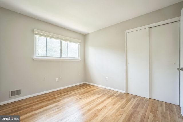7826 Glenister Dr, Springfield, VA 22152 - unfurnished bedroom featuring wood finished floors and a closet