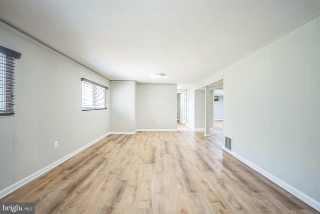 7826 Glenister Dr, Springfield, VA 22152 - spare room with light wood-style flooring and ornamental molding
