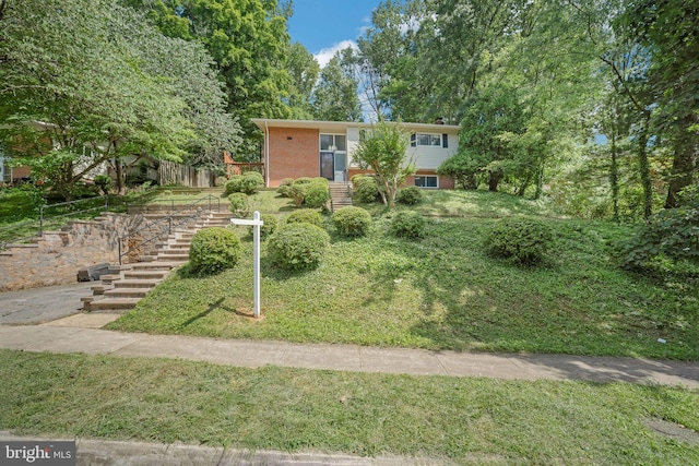 7826 Glenister Dr, Springfield, VA 22152 - view of front of house featuring stairs, brick siding, and a front lawn