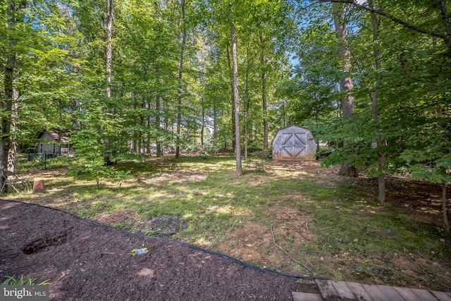 7826 Glenister Dr, Springfield, VA 22152 - view of yard with a storage unit