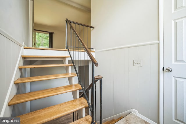7826 Glenister Dr, Springfield, VA 22152 - stairs with a decorative wall and a wainscoted wall