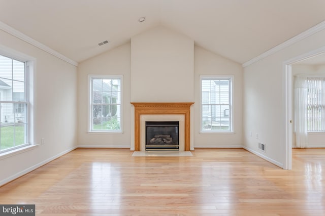 1826 Kershaw Ln, Winchester, VA 22601 - unfurnished living room featuring light wood finished floors, healthy amount of natural light, a fireplace with flush hearth, vaulted ceiling, and crown molding