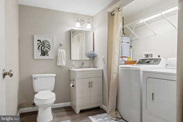 65 Petersburg Ln, Duncannon, PA 17020 - full bath with washing machine and clothes dryer, wood finished floors, vanity, and water heater