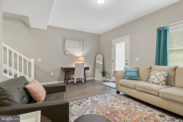65 Petersburg Ln, Duncannon, PA 17020 - living area with plenty of natural light, wood finished floors, and stairway
