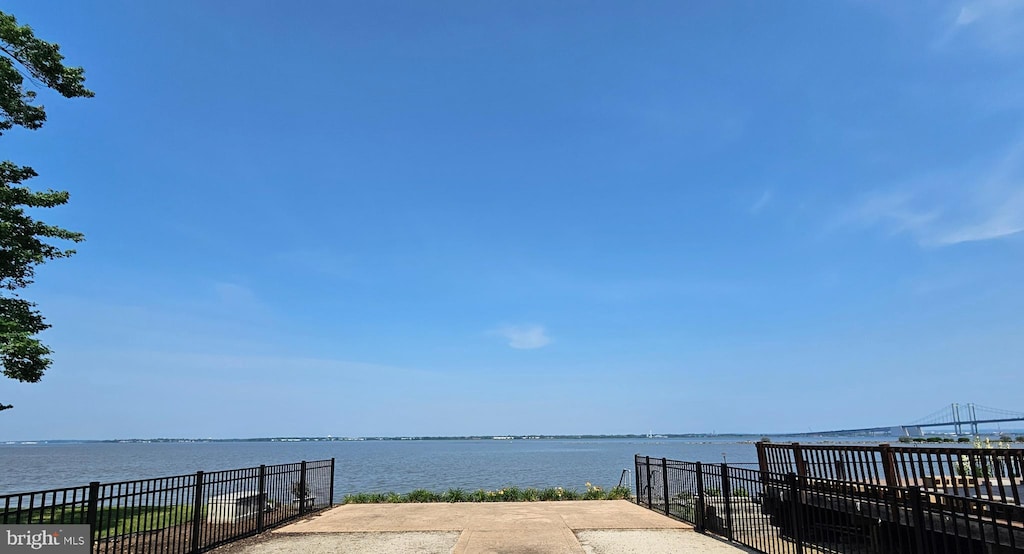 surrounding community featuring a water view