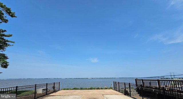 surrounding community featuring a water view