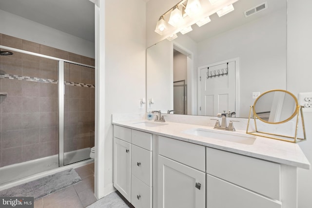 135 Burkwood Ter, Lake Frederick, VA 22630 - full bath featuring double vanity, a stall shower, and tile patterned floors