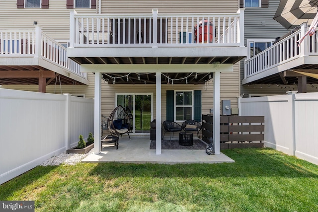 135 Burkwood Ter, Lake Frederick, VA 22630 - back of property with a fenced backyard, a patio, and an outdoor hangout area