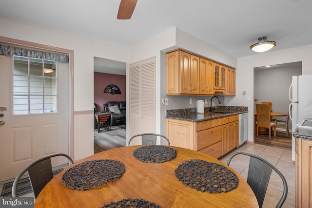 20103 Halethorpe Ln Unit 130, Germantown, MD 20876 - kitchen featuring white appliances, a ceiling fan, glass insert cabinets, light tile patterned floors, and dark stone countertops