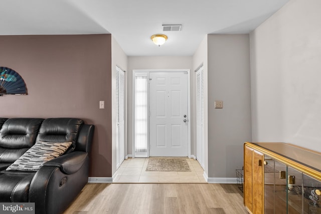 20103 Halethorpe Ln Unit 130, Germantown, MD 20876 - foyer entrance with light wood-type flooring and baseboards