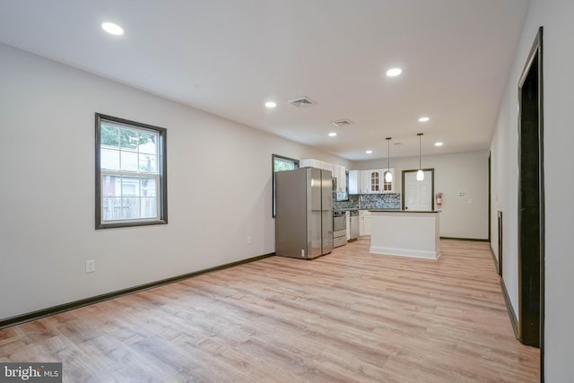 11 Sunset Ln, Bridgeton, NJ 08302 - kitchen featuring appliances with stainless steel finishes, light wood finished floors, decorative backsplash, recessed lighting, and white cabinets