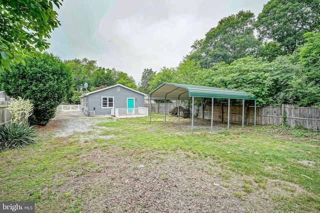 11 Sunset Ln, Bridgeton, NJ 08302 - fenced backyard featuring a carport and driveway