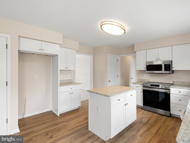 8 Taylors Farm Dr, Newark, DE 19711 - kitchen featuring stainless steel appliances, light wood-style floors, and white cabinets