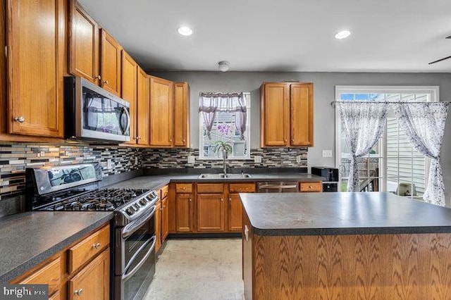 30 Homestead Dr, Pemberton, NJ 08068 - kitchen featuring appliances with stainless steel finishes, dark countertops, tasteful backsplash, recessed lighting, and brown cabinets