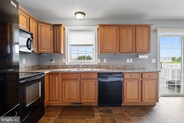 355 Old Stone Way, York, PA 17406 - kitchen featuring black appliances and brown cabinets
